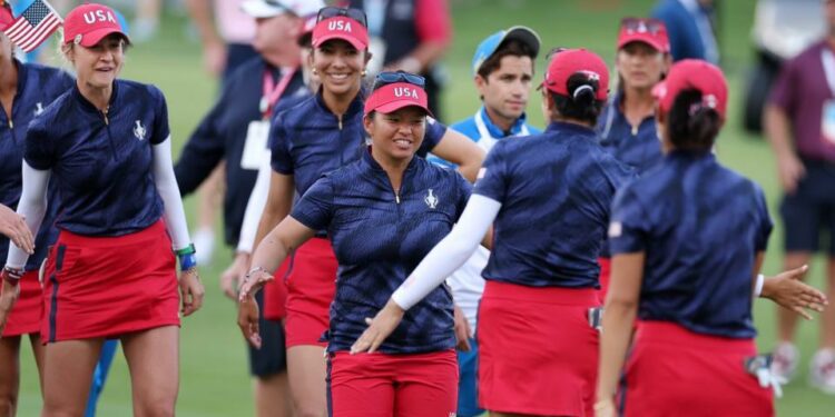 Megan Khang and Nelly Korda of Team United States react with teammates Rose Zhang and Andrea Lee after winning their match during the Friday Fourball matches against Team Europe during the first round of the Solheim Cup 2024 at Robert Trent Jones Golf Club on September 13, 2024 in Gainesville, Virginia.