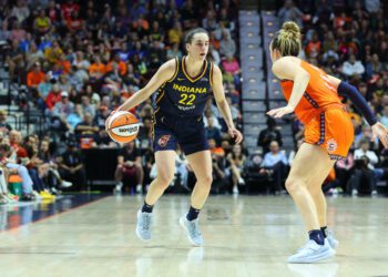 UNCASVILLE, CT - SEPTEMBER 22: Indiana Fever guard Caitlin Clark (22) defended by Connecticut Sun guard Marina Mabrey (4) during the First Round and game 1 of the 2024 WNBA playoffs between Indiana Fever and Connecticut Sun on September 22, 2024, at Mohegan Sun Arena in Uncasville, CT. (Photo by M. Anthony Nesmith/Icon Sportswire via Getty Images)