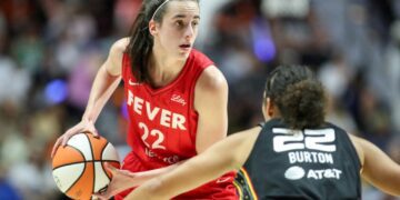 Indiana Fever guard Caitlin Clark (22) possesses the ball during the first half against the Connecticut Sun during game two of the first round of the 2024 WNBA Playoffs at Mohegan Sun Arena.