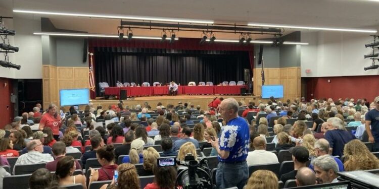 Over 500 people filled the auditorium at Indian Valley Middle School in Harleysville on Aug. 29, most demanding the resignation of board member Bill Formica. The district is now checking identification to give residents priority seating, possibly running afoul of open meetings laws.