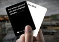 A mockup of two cards in the style of the Cards Against Humanity game. One card says