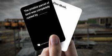 A mockup of two cards in the style of the Cards Against Humanity game. One card says