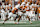 AUSTIN, TEXAS - SEPTEMBER 14: Arch Manning #16 of the Texas Longhorns fakes a handoff to Jerrick Gibson #9 and looks to pass in the second half against the UTSA Roadrunners at Darrell K Royal-Texas Memorial Stadium on September 14, 2024 in Austin, Texas. (Photo by Tim Warner/Getty Images)