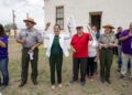 Secretary of the Interior Deb Haaland, center left, Blackwell School alumni Joe Cabezuela, center r...