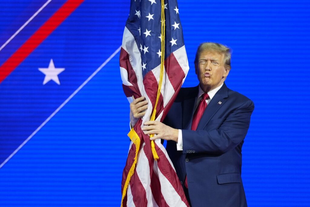 Donald Trump Hugs US Flag