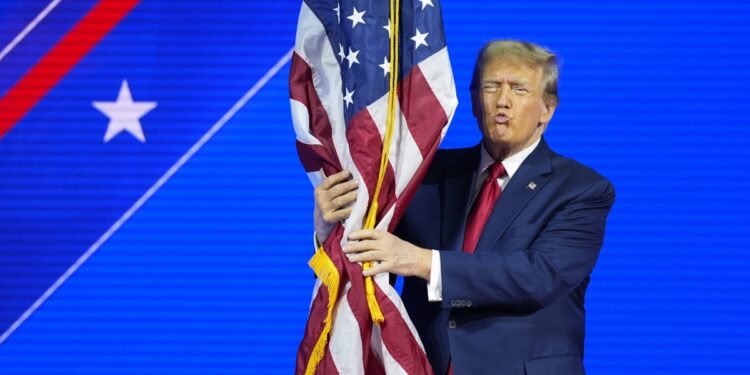 Donald Trump Hugs US Flag