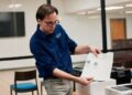 An election official carries out an elections security health check at the Dekalb County election headquarters