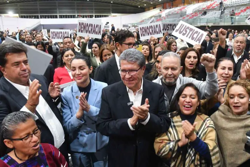 Deputy Ricardo Monreal stands at the front of a crowd celebrating the passage of the judicial reform bill in Mexico's Chamber of Deputies