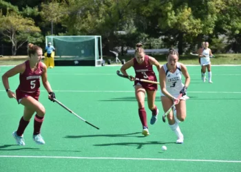 Junior defender Makenzie Switzer and senior midfielder Laine Delmotte try to keep up with a New Hampshire player. (Photo courtesy of University of New Hampshire Athletics)