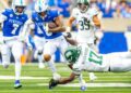 Ohio defensive end Marcel Walker-Burgess (17) tries to tackle Kentucky wide receiver Dane Key (6) during Saturday’s game at Kroger Field.