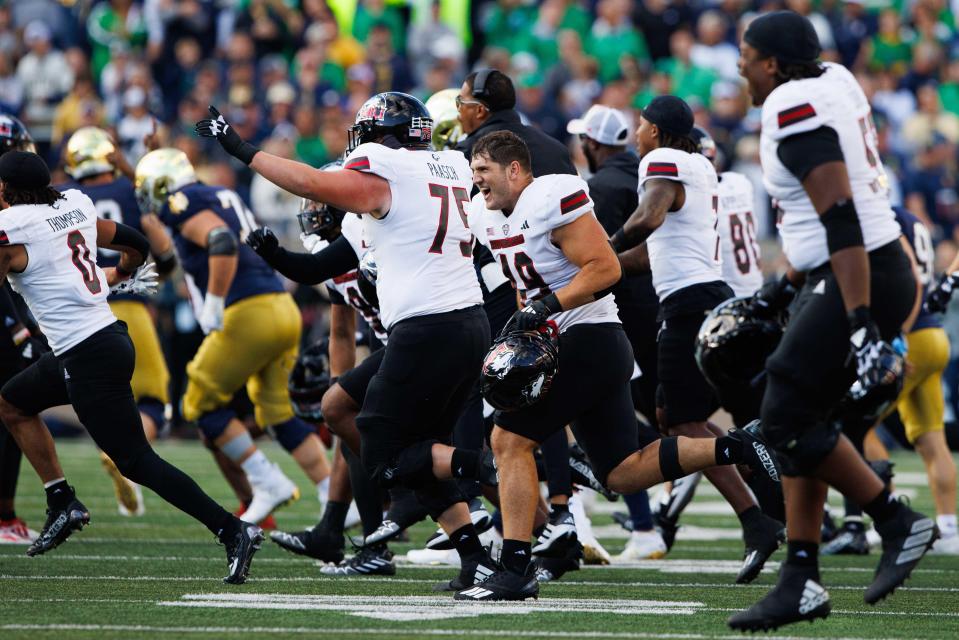 Northern Illinois celebrates after wining a NCAA college football game 16-14 against Notre Dame at Notre Dame Stadium on Saturday, Sept. 7, 2024, in South Bend.