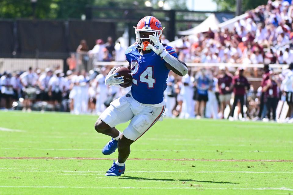 Sep 21, 2024; Starkville, Mississippi, USA; Florida Gators running back Ja'Kobi Jackson (24) runs the ball against the Mississippi State Bulldogs during the second quarter at Davis Wade Stadium at Scott Field. Mandatory Credit: Matt Bush-Imagn Images