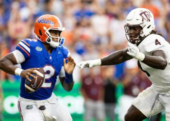 Sep 14, 2024; Gainesville, Florida, USA; Florida Gators quarterback DJ Lagway (2) evades Texas A&M Aggies defensive lineman Shemar Stewart (4) during the first half at Ben Hill Griffin Stadium. Mandatory Credit: Matt Pendleton-Imagn Images