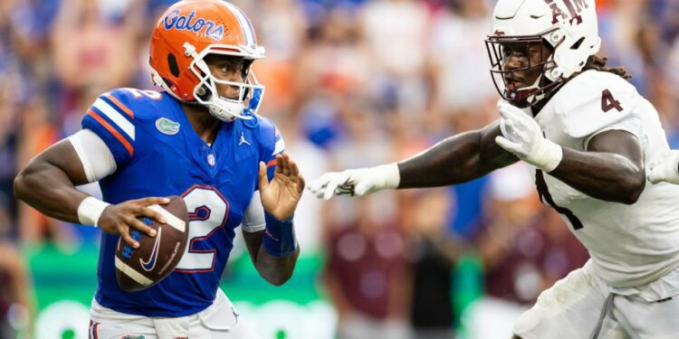 Sep 14, 2024; Gainesville, Florida, USA; Florida Gators quarterback DJ Lagway (2) evades Texas A&M Aggies defensive lineman Shemar Stewart (4) during the first half at Ben Hill Griffin Stadium. Mandatory Credit: Matt Pendleton-Imagn Images