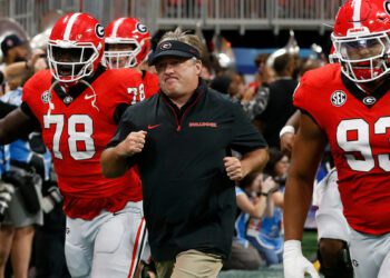 Georgia coach Kirby Smart leads his team onto the field before the start of the NCAA Aflac Kickoff Game in Atlanta, on Saturday, Aug. 31, 2024.