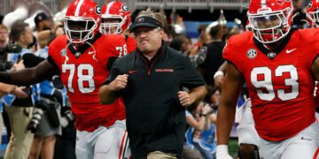 Georgia coach Kirby Smart leads his team onto the field before the start of the NCAA Aflac Kickoff Game in Atlanta, on Saturday, Aug. 31, 2024.