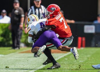 Daniel Harris (7) tackles Tennessee Tech wide receiver Jay Parker (4) at Sanford Stadium on September 7, 2024.