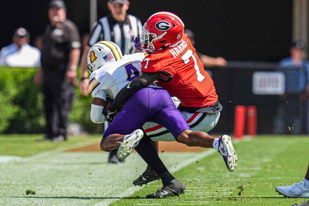 Daniel Harris (7) tackles Tennessee Tech wide receiver Jay Parker (4) at Sanford Stadium on September 7, 2024. 