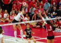 Oct 21, 2023; Lincoln, NE, USA; Nebraska Cornhuskers outside hitter Merritt Beason (13) attacks against Wisconsin Badgers middle blocker Caroline Crawford (9) during the fifth set at the Bob Devaney Sports Center. Mandatory Credit: Dylan Widger-USA TODAY Sports