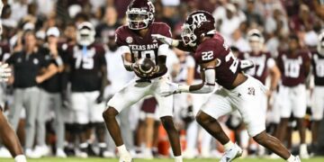 Sep 21, 2024; College Station, Texas, USA; Texas A&M Aggies quarterback Marcel Reed (10) hands off the ball to running back EJ Smith (22) during the fourth quarter at Kyle Field. Mandatory Credit: Maria Lysaker-Imagn Images.