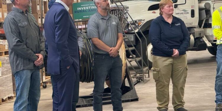 President Joe Biden speaks with employees as he tours the Vernon Electric Cooperative in Westby, Wisconsin, on September 5, 2024.