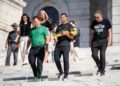 Boston Celtics Coach Joe Mazzulla, a Rhode Island native, walks down the Rhode Island State House steps with the NBA championship trophy along with Celtics co-owner Steve Pagliuca, left, and Rhode Island Governor Daniel J. McKee, right.