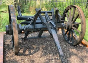 The front wheels, axle and shaft of the Conestoga-style wagon that once sat outside of the Old Westport Shopping Center, at Westport Road and Southwest Trafficway, are now on display on the grounds of the Harris-Kearney Historical House Museum.