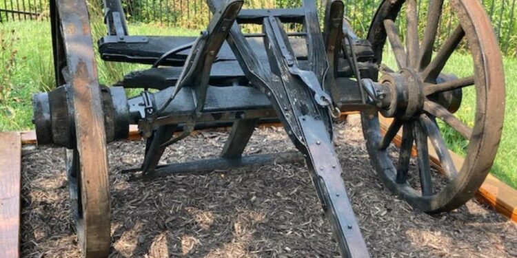 The front wheels, axle and shaft of the Conestoga-style wagon that once sat outside of the Old Westport Shopping Center, at Westport Road and Southwest Trafficway, are now on display on the grounds of the Harris-Kearney Historical House Museum.