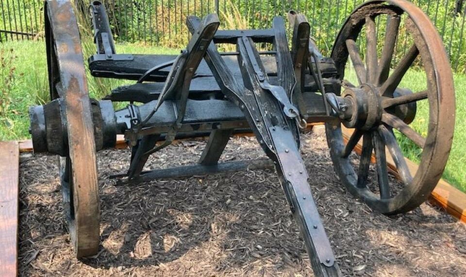 The front wheels, axle and shaft of the Conestoga-style wagon that once sat outside of the Old Westport Shopping Center, at Westport Road and Southwest Trafficway, are now on display on the grounds of the Harris-Kearney Historical House Museum.