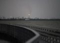 A flaring stack in Port Comfort can be seen from a nature boardwalk in Port Lavaca, Texas, on July 7, 2024.