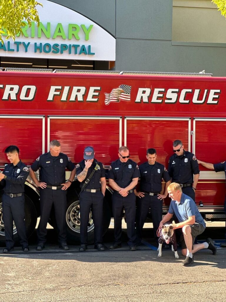 Maya with the firefighters who helped save her and her family.