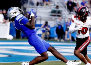 Middle Tennessee wide receiver Omari Kelly (1) catches a pass as Western Kentucky defensive back Jaymar Mundy (10) looks on during the rivalry football game at MTSU, on Saturday, Sept. 14, 2024.