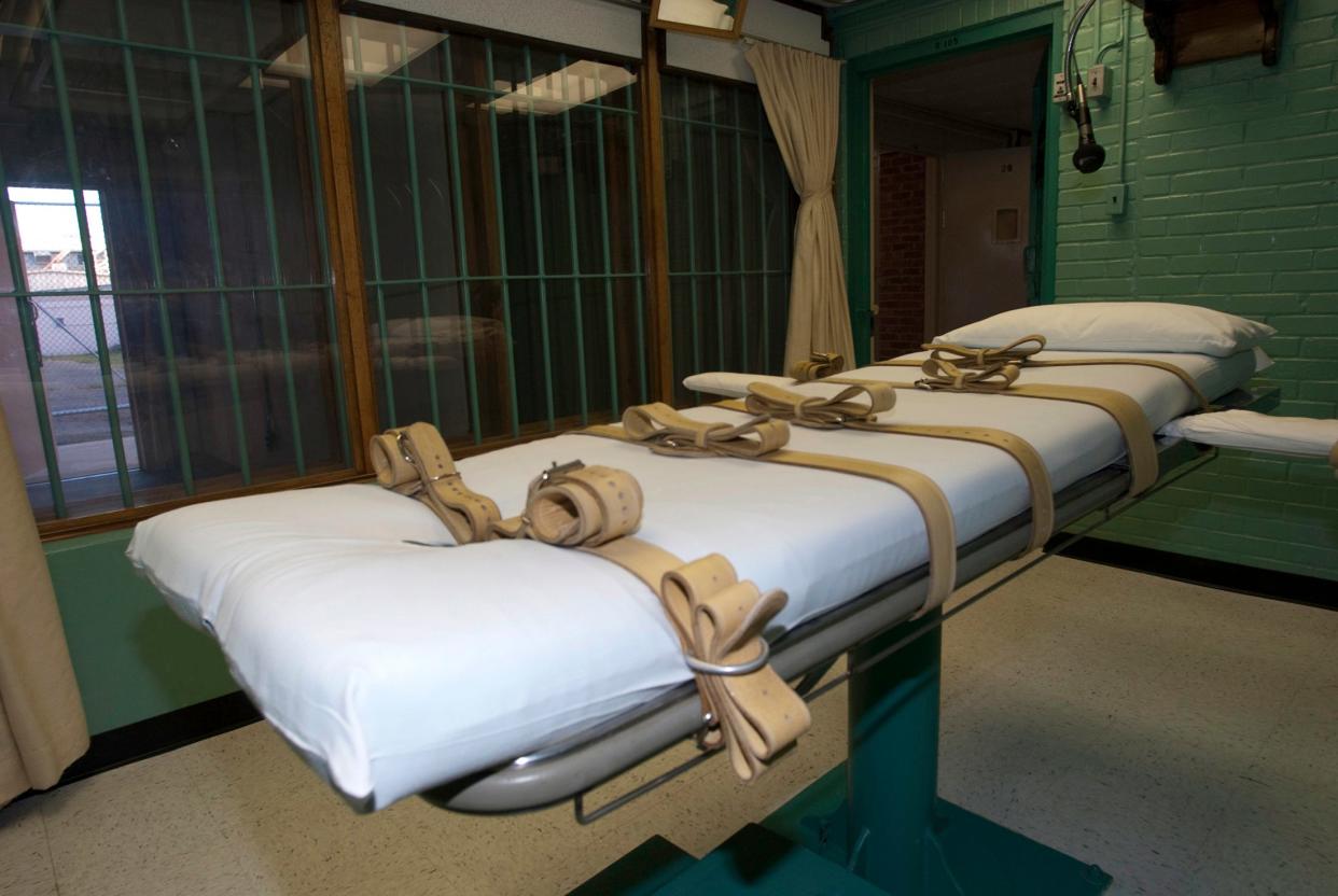 The death chamber and the steel bars of the viewing room are seen at the state penitentiary in Huntsville, Texas, U.S. on September 29, 2010.