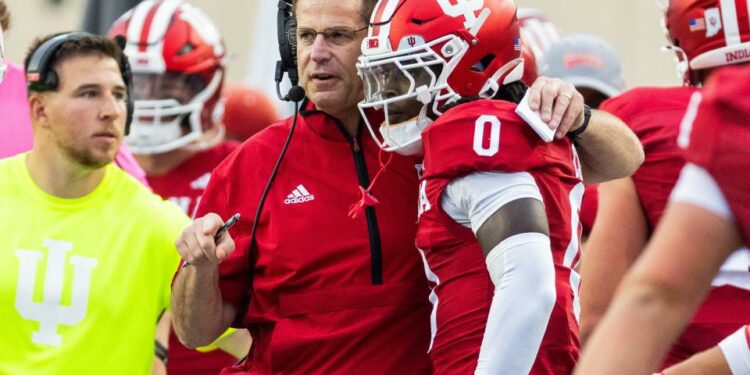 Sep 6, 2024; Bloomington, Indiana, USA; Indiana Hoosiers head coach Curt Cignetti talks with Indiana Hoosiers wide receiver Andison Coby (0) in the first quarter against the Western Illinois Leathernecks at Memorial Stadium. Mandatory Credit: Trevor Ruszkowski-Imagn Images