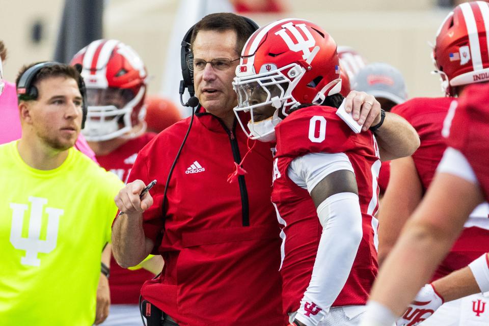 Sep 6, 2024; Bloomington, Indiana, USA; Indiana Hoosiers head coach Curt Cignetti talks with Indiana Hoosiers wide receiver Andison Coby (0) in the first quarter against the Western Illinois Leathernecks at Memorial Stadium. Mandatory Credit: Trevor Ruszkowski-Imagn Images