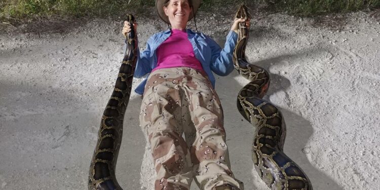 Donna Kalil poses with one of her catches. Kalil is a hunter with the South Florida Water Management District’s python elimination program. Contributed by Donna Kalil