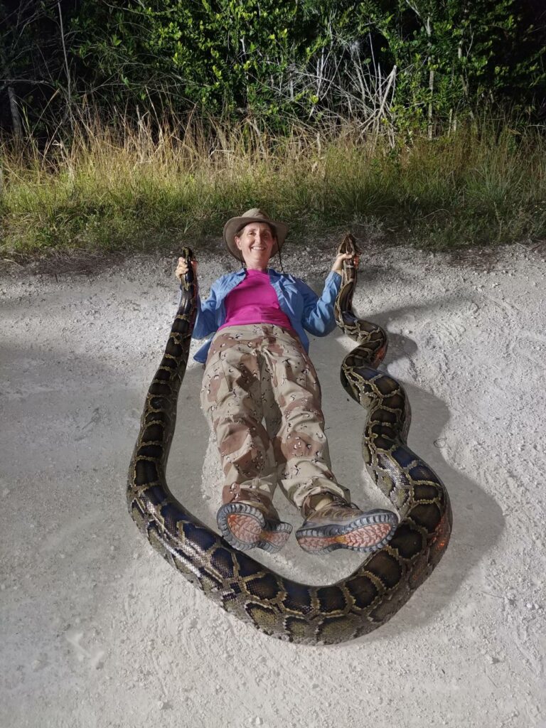 Donna Kalil poses with one of her catches. Kalil is a hunter with the South Florida Water Management District’s python elimination program. Contributed by Donna Kalil