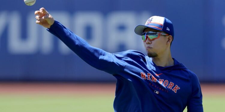 New York Mets injured starting pitcher Kodai Senga (34) throws a baseball in the outfield before a game against the Arizona Diamondbacks at Citi Field