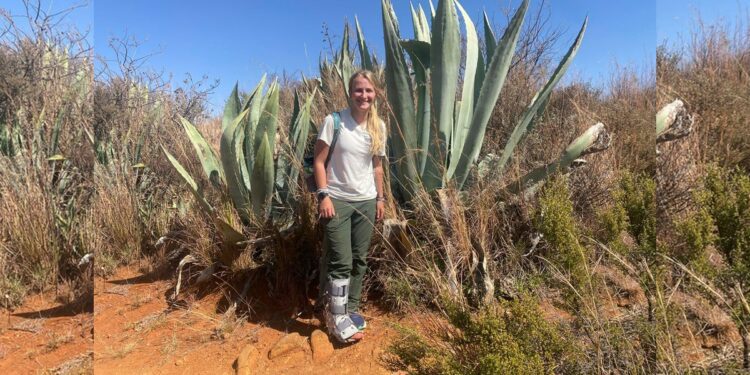 Brook Cheuvront wears medical boot outdoors