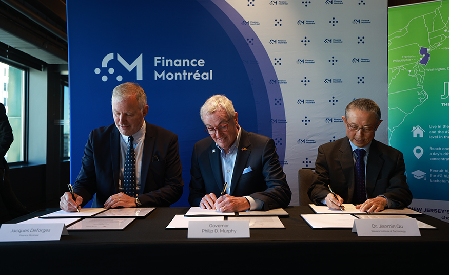 As part of New Jersey's economic mission to Canada, Gov. Phil Murphy joined Jacques Deforges (far left), CEO of Finance Montréal, and Jianmin Qu (right), Stevens Institute of Technology's senior vice president for academic affairs and provost, to witness the signing of a Memorandum of Understanding intended to strengthen the connections between fintech developments in the Montréal/Quebec and New York/New Jersey global financial centers.