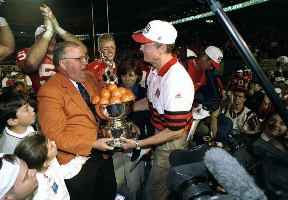 2 Jan 1998: Head coach Tom Osbourne of the Nebraska Cornhuskers holds a trophy after the Orange Bowl against the Tennessee Volunteers at Pro Player Stadium in Miami, Florida. Nebraska won the game, 42-17.