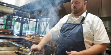 Chef Sam Gelman grills Iowa pork at The Webster restraurant, The Webster. Gelman and his wife, Riene Gelman, announced plans to a new ramen restaurant and cocktail lounge duo with Webster team member Edwin Lee. The new restaurant will open in October 2024. (Cliff Jette/Freelance for the Gazette)