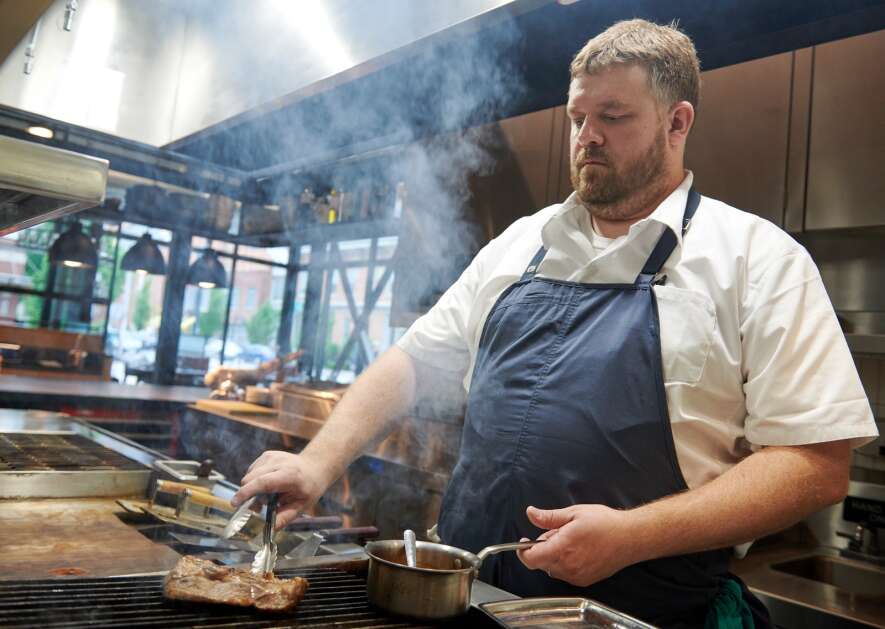 Chef Sam Gelman grills Iowa pork at The Webster restraurant, The Webster. Gelman and his wife, Riene Gelman, announced plans to a new ramen restaurant and cocktail lounge duo with Webster team member Edwin Lee. The new restaurant will open in October 2024. (Cliff Jette/Freelance for the Gazette)