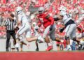 Aug 31, 2024; Columbus, OH, USA; Ohio State Buckeyes defensive tackle Tyleik Williams (91) pursues Akron Zips quarterback Ben Finley (10) during the NCAA football game at Ohio Stadium. Ohio State won 52-6.