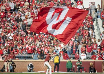 An OU flag is flown during a college football game between the University of Oklahoma Sooners (OU) and the Baylor Bears at Gaylord Family - Oklahoma Memorial Stadium in Norman, Okla., Saturday, Nov. 5, 2022. Nathan Fish, The Oklahoman