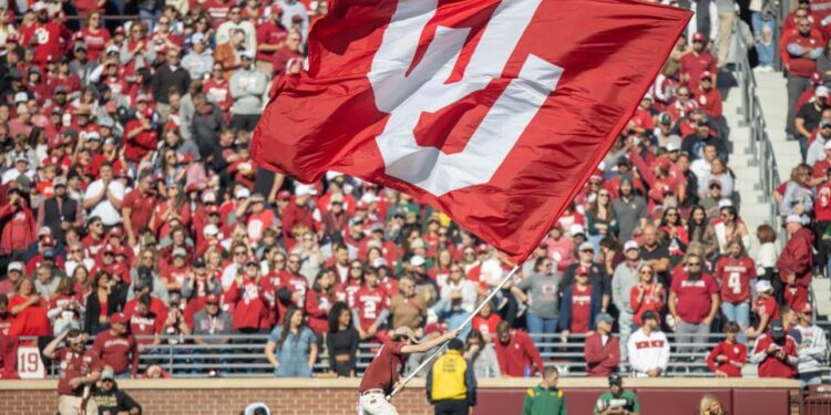 An OU flag is flown during a college football game between the University of Oklahoma Sooners (OU) and the Baylor Bears at Gaylord Family - Oklahoma Memorial Stadium in Norman, Okla., Saturday, Nov. 5, 2022. Nathan Fish, The Oklahoman