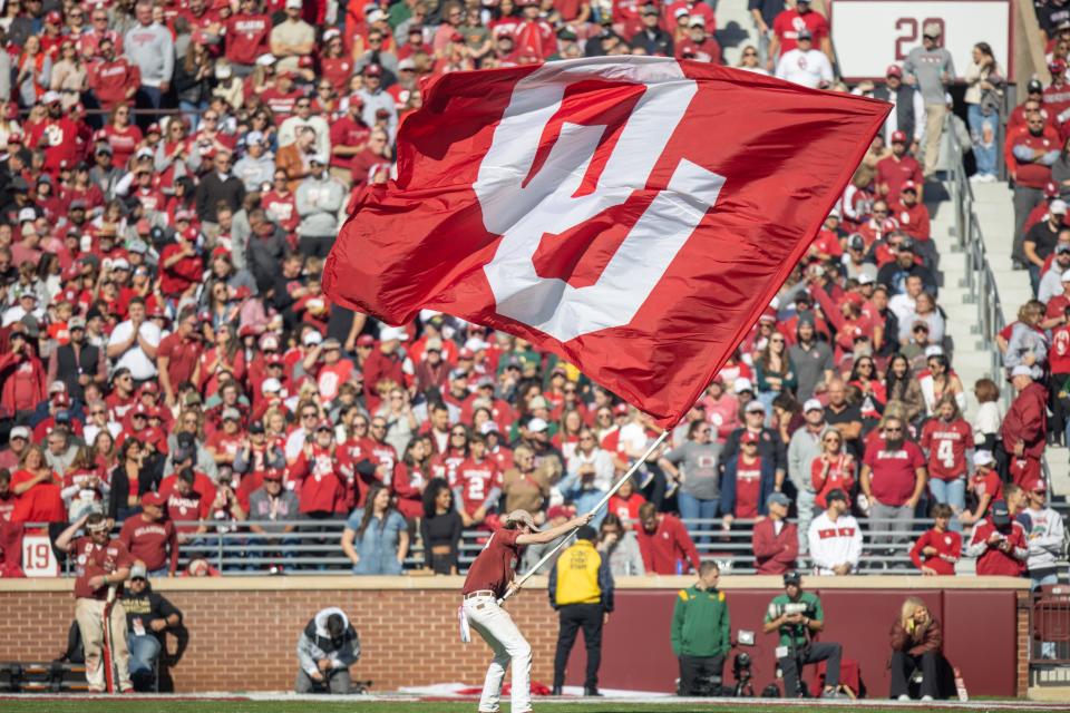 An OU flag is flown during a college football game between the University of Oklahoma Sooners (OU) and the Baylor Bears at Gaylord Family - Oklahoma Memorial Stadium in Norman, Okla., Saturday, Nov. 5, 2022. Nathan Fish, The Oklahoman