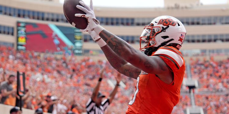 Oklahoma State's Ollie Gordon II (0) celebrates his touchdown in the second half of the college football game between the Oklahoma State Cowboys and South Dakota State Jackrabbits at Boone Pickens Stadium