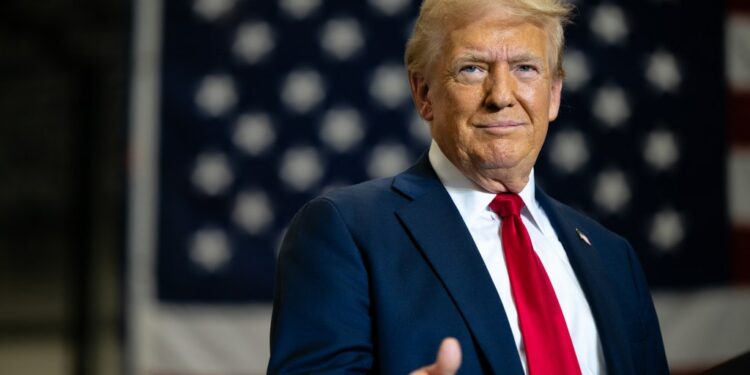 Former U.S. President Donald Trump, the Republican presidential nominee, giving a thumbs up as he arrives for a campaign rally at the Mosack Group warehouse in Mint Hill, North Carolina