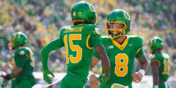 Oregon Ducks quarterback Dillon Gabriel and Oregon Ducks wide receiver Tez Johnson celebrate a touchdown by Johnson as the Oregon Ducks host the Idaho Vandals Saturday, Aug. 31, 2024 at Autzen Stadium in Eugene, Ore.